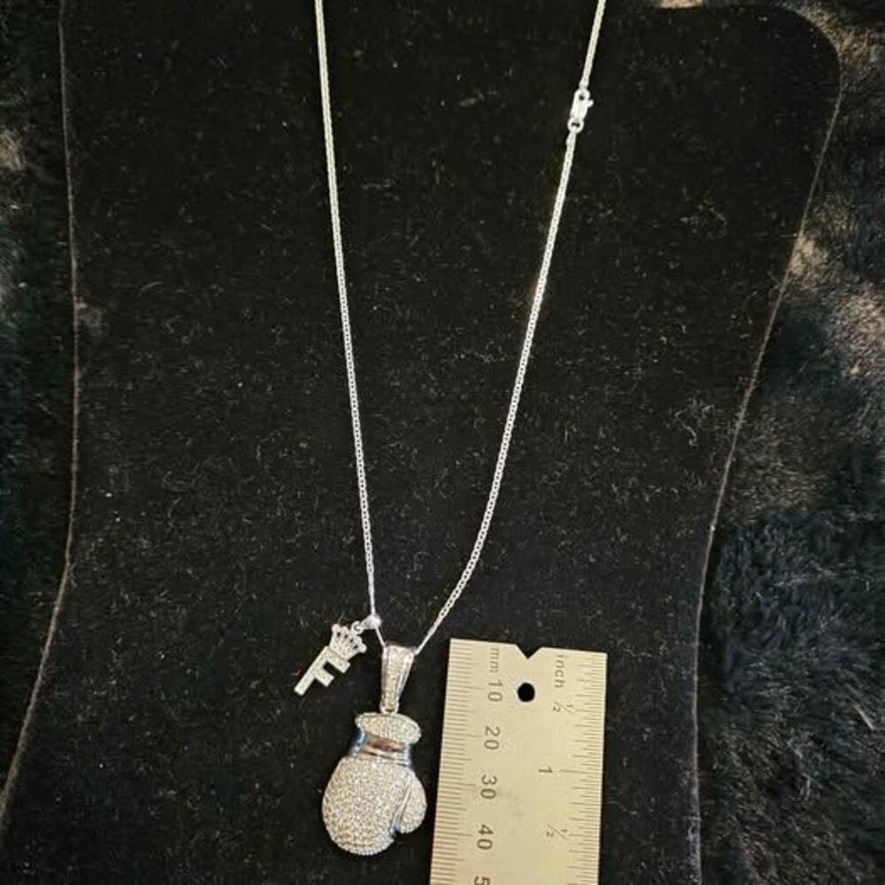 Moissanite boxing pendant and fighter crown on 20" Figaro sterling necklace.